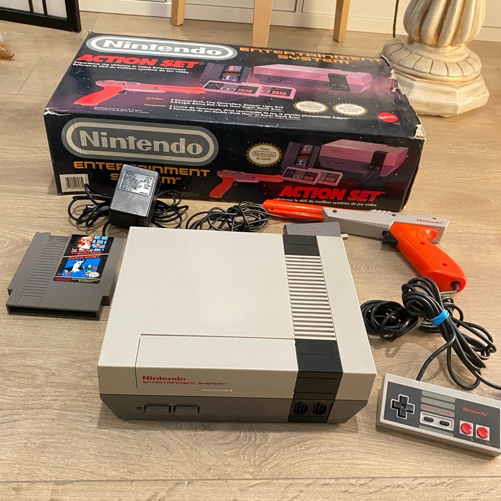 Nintendo NES videogame console with box, zapper gun, controller, wires and game